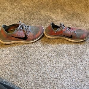 Grey and pink nike flyknit